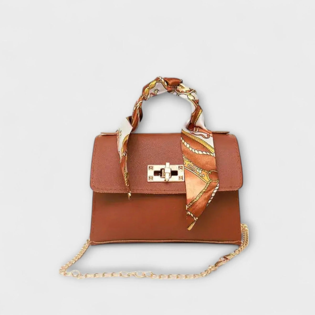 Brown faux leather handbag with scarf handle and chain strap.