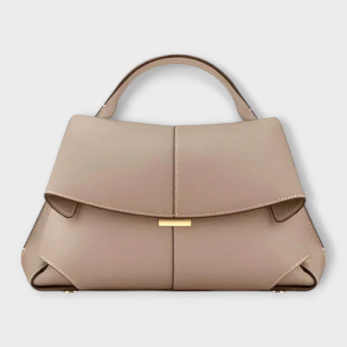 Beige leather top-handle handbag with flap closure and contrast stitching.