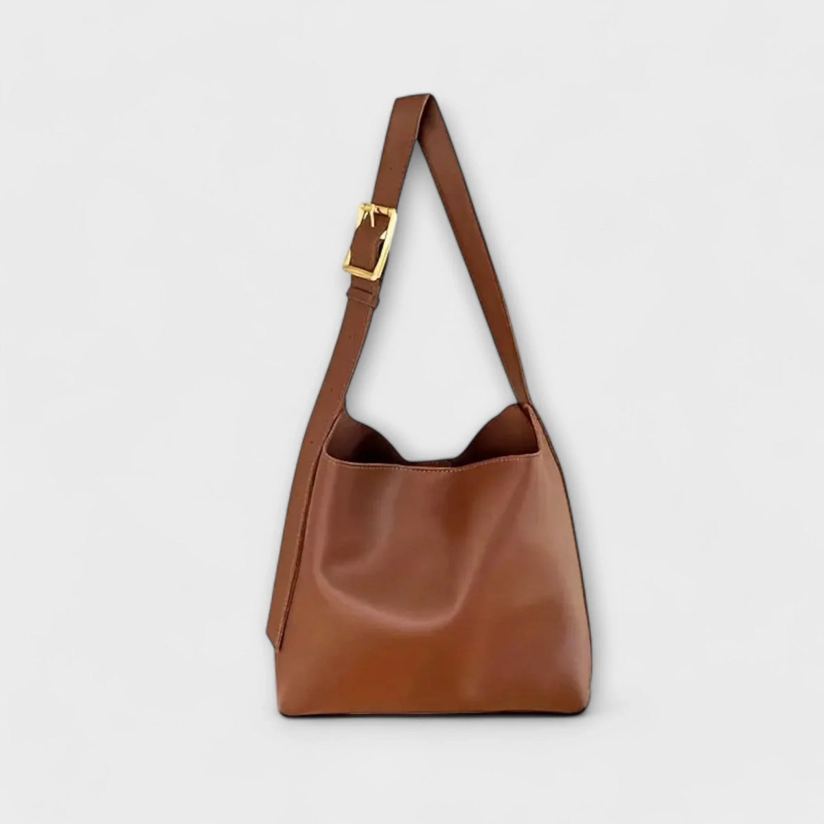 Brown faux leather hobo shoulder bag with adjustable buckle strap.
