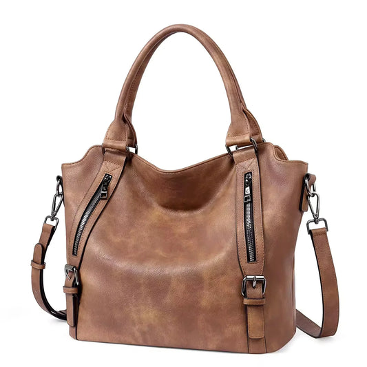 Brown faux leather shoulder tote bag with front zips and buckles.
