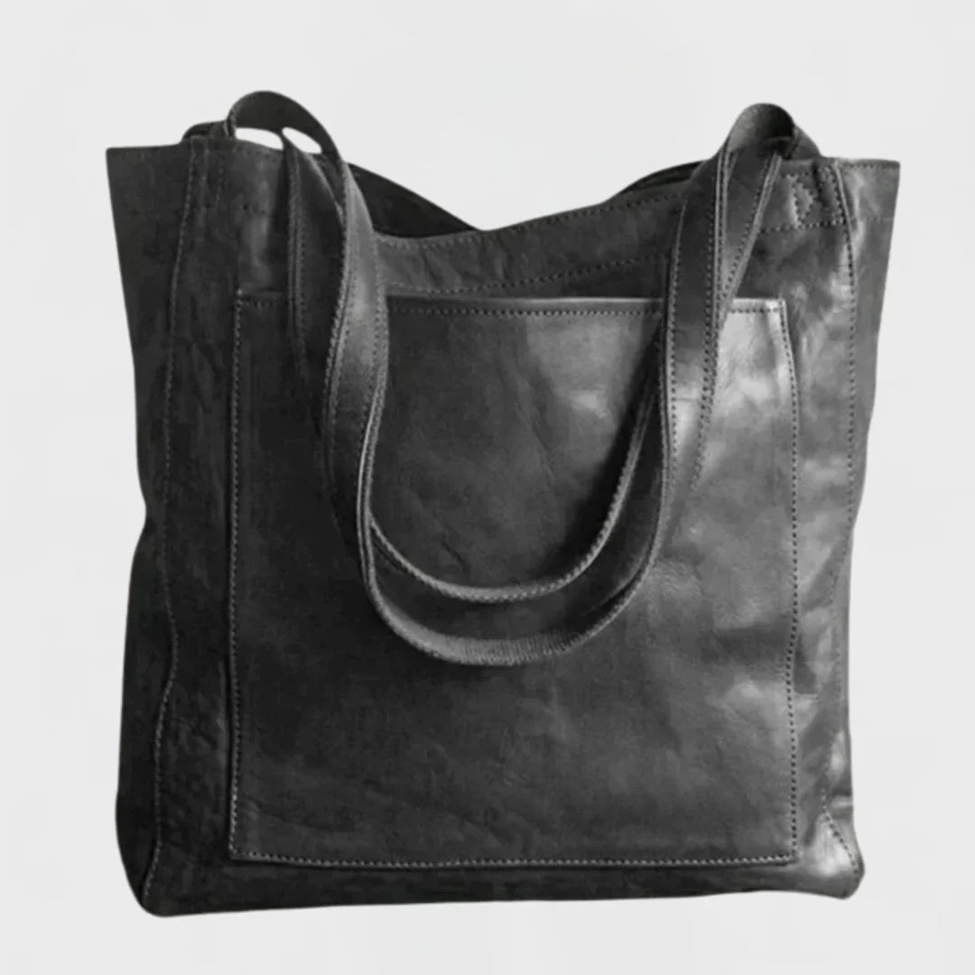 Brown leather tote with front patch pocket, double shoulder straps.