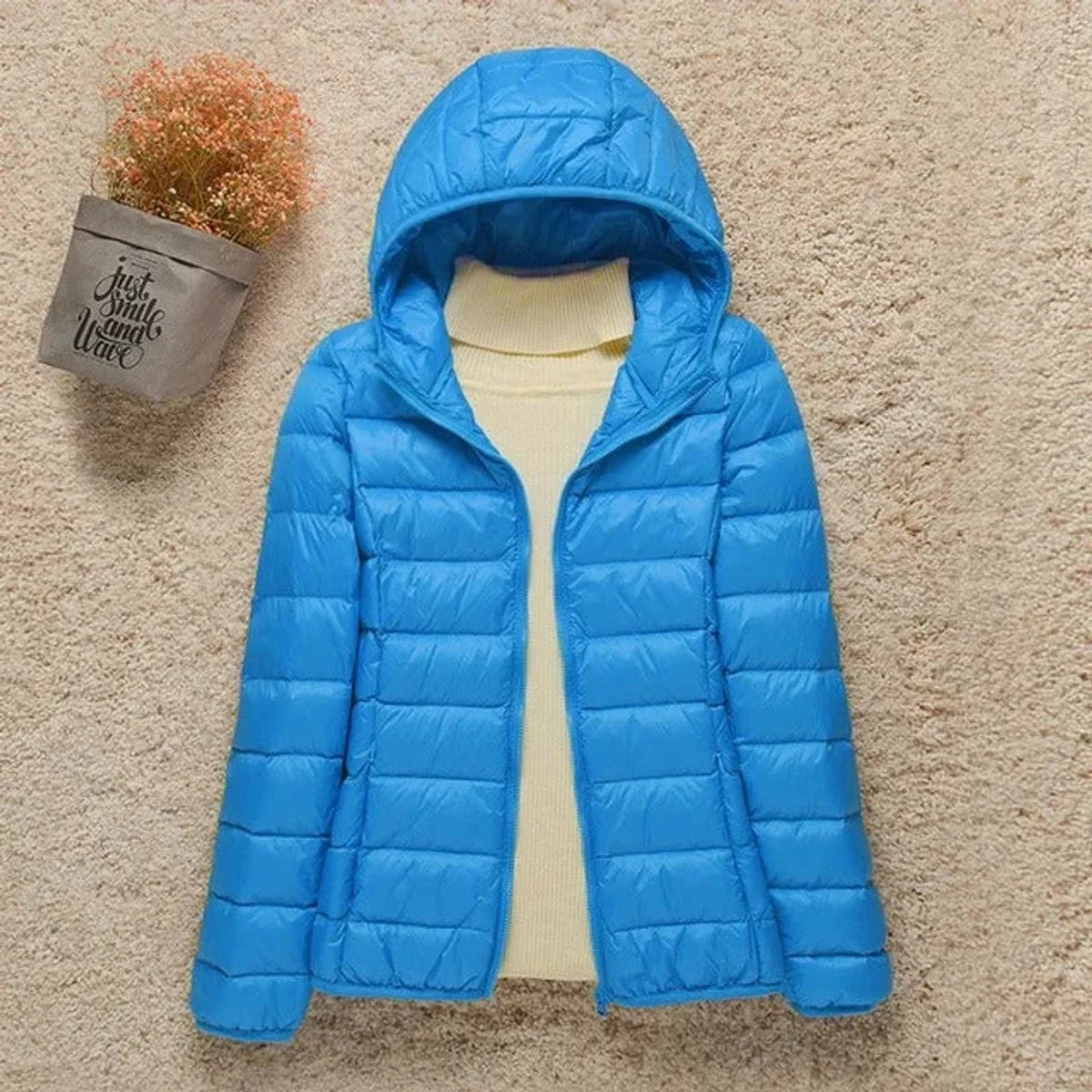 Women's lightweight hooded quilted jacket packable puffer in Light Blue