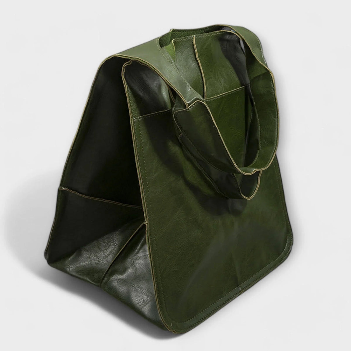 Large black faux leather tote bag with two exterior slip pockets.