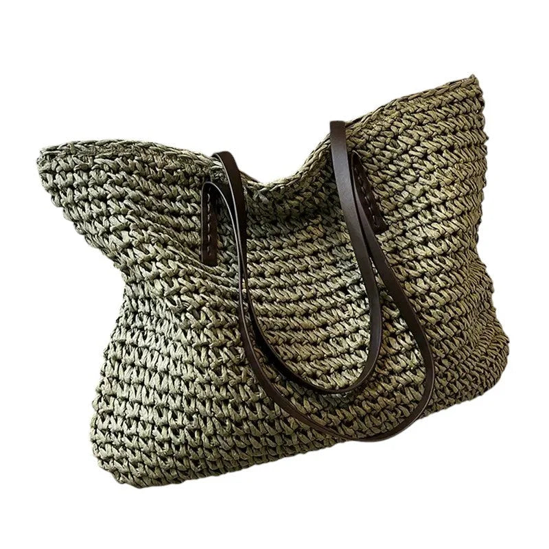 Green spacious woven straw tote with double faux-leather straps.