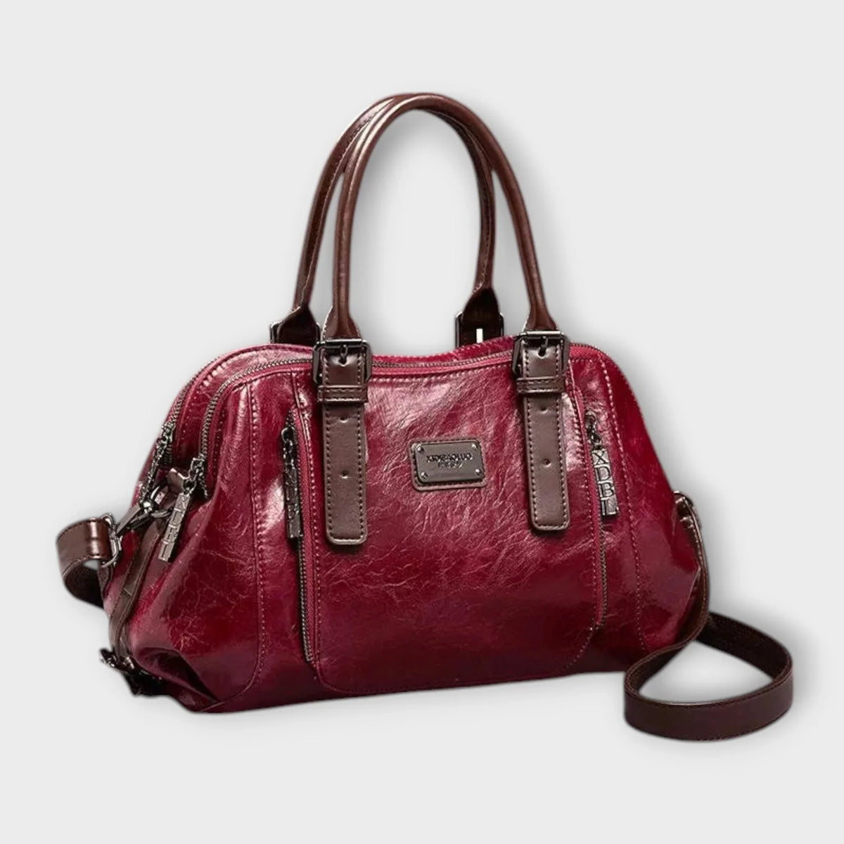 Red structured faux leather bag, top handles & zip pockets.