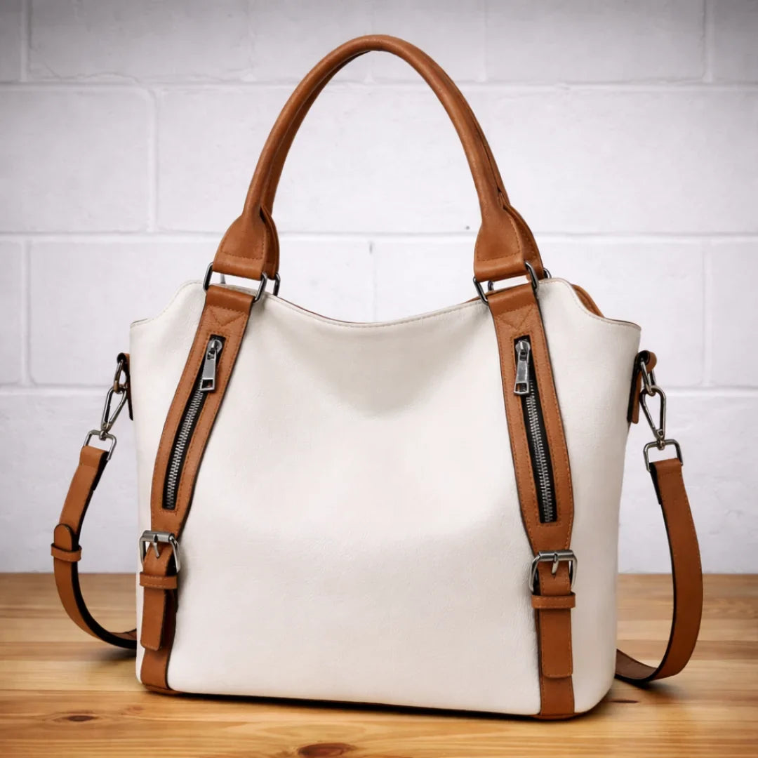 Women's tan faux-leather slouchy crossbody shoulder bag with dual zip pockets
