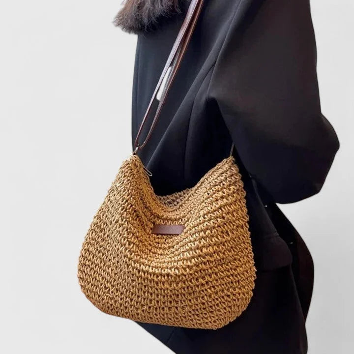 Women's woven straw hobo shoulder bag with adjustable faux-leather strap